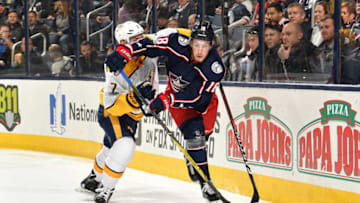 COLUMBUS, OH - NOVEMBER 7: Pierre-Luc Dubois #18 of the Columbus Blue Jackets looks to pass the puck away from Yannick Weber #7 of the Nashville Predators during the first period of a game on November 7, 2017 at Nationwide Arena in Columbus, Ohio. (Photo by Jamie Sabau/NHLI via Getty Images)