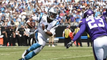 Sep 25, 2016; Charlotte, NC, USA; Carolina Panthers quarterback Cam Newton (1) scores a touchdown as Minnesota Vikings running back Ronnie Hillman (23) defends in the first quarter at Bank of America Stadium. Mandatory Credit: Bob Donnan-USA TODAY Sports