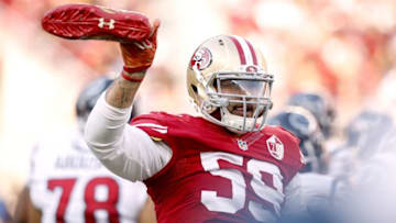 Aug 14, 2016; Santa Clara, CA, USA; San Francisco 49ers linebacker Aaron Lynch (59) holds onto his shoe after it came off during action against the Houston Texans in the third quarter at Levi