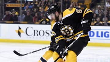 Apr 9, 2016; Boston, MA, USA; Boston Bruins defenseman Kevan Miller (86) tries to control the puck during the second period against the Ottawa Senators at TD Garden. Mandatory Credit: Bob DeChiara-USA TODAY Sports