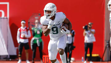 BLOOMINGTON, IN - OCTOBER 16: Kenneth Walker III #9 of the Michigan State Spartans runs the ball during the game against the Indiana Hoosiers at Indiana University on October 16, 2021 in Bloomington, Indiana. (Photo by Michael Hickey/Getty Images)