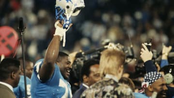 Detroit Lions tackle Lomas Brown (75) is all smiles as he leaves the field following the Lions 38-6 victory over the Dallas Cowboys in the 1991 NFC Divisional Playoff Game on January 5, 1992 at the Pontiac Silverdome in Pontiac Michigan. (Photo by Betsy Peabody Rowe/Getty Images)