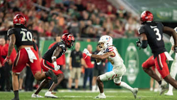 Cincinnati Bearcats take on South Florida Bulls at Raymond James Stadium. USA Today.
