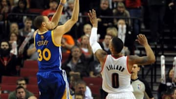 Mar 16, 2014; Portland, OR, USA; Golden State Warriors guard Stephen Curry (30) shoots the ball over Portland Trail Blazers guard Damian Lillard (0) during the fourth quarter of the game at the Moda Center. The Warriors won the game 113-112. Mandatory Credit: Steve Dykes-USA TODAY Sports