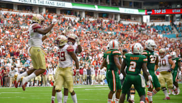 MIAMI, FL - OCTOBER 06: Florida State Seminoles celebrate a touchdown by Keith Gavin #89 of the Florida State Seminoles in the first half against the Miami Hurricanes at Hard Rock Stadium on October 6, 2018 in Miami, Florida. (Photo by Mark Brown/Getty Images)