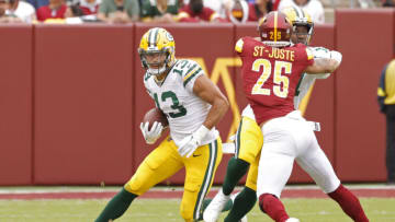 Oct 23, 2022; Landover, Maryland, USA; Green Bay Packers wide receiver Allen Lazard (13) runs with the ball as Washington Commanders cornerback Benjamin St-Juste (25) defends during the second quarter at FedExField. Mandatory Credit: Geoff Burke-USA TODAY Sports