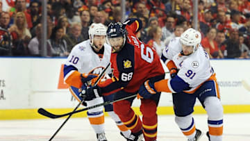 Apr 22, 2016; Sunrise, FL, USA; Florida Panthers right winger Jaromir Jagr (68) splits the defense of New York Islanders center Alan Quine (10) and John Tavares (91) during second period action in game five of the first round of the 2016 Stanley Cup Playoffs at BB&T Center. Mandatory Credit: Robert Duyos-USA TODAY Sports