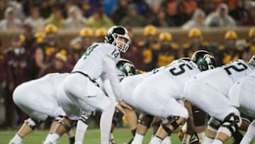 MINNEAPOLIS, MN - OCTOBER 14: Brian Lewerke #14 of the Michigan State Spartans calls a play at the line of scrimmage against the Minnesota Golden Gophers during the game on October 14, 2017 at TCF Bank Stadium in Minneapolis, Minnesota. The Spartans defeated the Gophers 30-27. (Photo by Hannah Foslien/Getty Images)