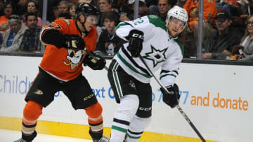 April 3, 2016; Anaheim, CA, USA; Dallas Stars center Radek Faksa (12) moves the puck against Anaheim Ducks defenseman Hampus Lindholm (47) during the first period at Honda Center. Mandatory Credit: Gary A. Vasquez-USA TODAY Sports