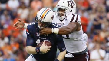 Sep 17, 2016; Auburn, AL, USA; Texas A&M Aggies lineman Myles Garrett (15) tackles Auburn Tigers quarterback Sean White (13) during the first quarter at Jordan Hare Stadium. Mandatory Credit: John Reed-USA TODAY Sports