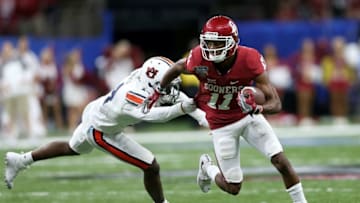 NEW ORLEANS, LA - JANUARY 02: Dede Westbrook #11 of the Oklahoma Sooners is tackled by Stephen Roberts #14 of the Auburn Tigers during the Allstate Sugar Bowl at the Mercedes-Benz Superdome on January 2, 2017 in New Orleans, Louisiana. (Photo by Matthew Stockman/Getty Images)