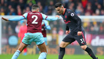 BURNLEY, ENGLAND - NOVEMBER 26: Matthew Lowton of Burnley and Sead Kolasinac of Arsenal in action during the Premier League match between Burnley and Arsenal at Turf Moor on November 26, 2017 in Burnley, England. (Photo by Alex Livesey/Getty Images)