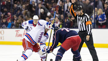 COLUMBUS, OH - NOVEMBER 17: Referee Chris Rooney (5) drops the puck for a face-off between New York Rangers center Boo Nieves (24) and Columbus Blue Jackets left wing Nick Foligno (71) during a game between the Columbus Blue Jackets and the New York Rangers on November 17, 2017, at Nationwide Arena in Columbus, OH. (Photo by Adam Lacy/Icon Sportswire via Getty Images)