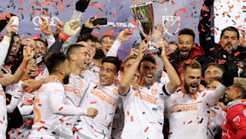 HARRISON, NEW JERSEY - NOVEMBER 29: The Atlanta United FC celebrate with the conference trophy after the Eastern Conference Finals Leg 2 match against the New York Red Bulls at Red Bull Arena on November 29, 2018 in Harrison, New Jersey. (Photo by Elsa/Getty Images)