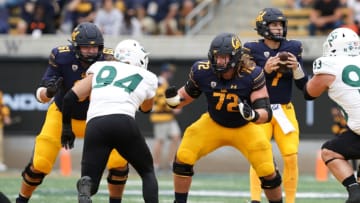 Auburn footballSep 18, 2021; Berkeley, California, USA; California Golden Bears offensive linemen McKade Mettauer (72) and Valentino Daltoso (61) block Sacramento State Hornets defensive lineman Wyatt Hjelm (94) during the first quarter at FTX Field at California Memorial Stadium. Mandatory Credit: Darren Yamashita-USA TODAY Sports