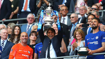 LONDON, ENGLAND - MAY 19: Antonio Conte, Manager of Chelsea lifts the Emirates FA Cup Trophy following his sides victory in The Emirates FA Cup Final between Chelsea and Manchester United at Wembley Stadium on May 19, 2018 in London, England. (Photo by Catherine Ivill/Getty Images)