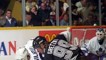 Wayne Gretzky #99 of the Los Angeles Kings skates against Doug Gilmour #93 of the Toronto Maple Leafs during NHL game action. Photo by Graig Abel/Getty Images)