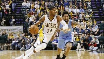 Feb 10, 2014; Indianapolis, IN, USA; Indiana Pacers forward Paul George (24) drives to the basket against Denver Nuggets forward Wilson Chandler (21) at Bankers Life Fieldhouse. Indiana defeats Denver 119-80. Mandatory Credit: Brian Spurlock-USA TODAY Sports