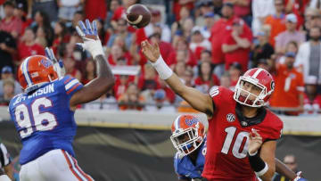 Oct 29, 2016; Jacksonville, FL, USA; Georgia Bulldogs quarterback Jacob Eason (10) throws the ball as Florida Gators defensive lineman Cece Jefferson (96) defends during the second half at EverBank Field. Florida Gators defeated the Georgia Bulldogs 24-10. Mandatory Credit: Kim Klement-USA TODAY Sports