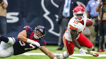 Sep 18, 2016; Houston, TX, USA; Kansas City Chiefs wide receiver Tyreek Hill (10) runs with the ball as Houston Texans linebacker Brennan Scarlett (57) attempts to make a tackle during the game at NRG Stadium. Mandatory Credit: Troy Taormina-USA TODAY Sports