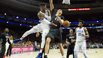 Jan 3, 2017; Philadelphia, PA, USA; Philadelphia 76ers forward Nerlens Noel (4) dishes off to center Joel Embiid (21) past Minnesota Timberwolves center Cole Aldrich (45) during the first half at Wells Fargo Center. Mandatory Credit: Bill Streicher-USA TODAY Sports
