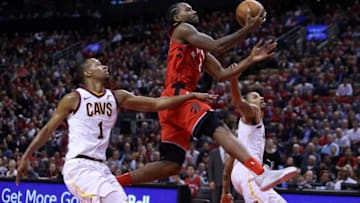TORONTO, ON - OCTOBER 17: Kawhi Leonard #2 of the Toronto Raptors shoots the ball as Rodney Hood #1 and George Hill #3 of the Cleveland Cavaliers defend during the second half of the NBA season opener at Scotiabank Arena on October 17, 2018 in Toronto, Canada. NOTE TO USER: User expressly acknowledges and agrees that, by downloading and or using this photograph, User is consenting to the terms and conditions of the Getty Images License Agreement. (Photo by Vaughn Ridley/Getty Images)