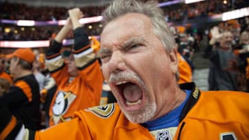 ANAHEIM, CA - APRIL 23: A Ducks fan cheers after a goal in Game Five of the Western Conference First Round against the Nashville Predators during the 2016 NHL Stanley Cup Playoffs at Honda Center on April 23, 2016 in Anaheim, California. (Photo by Debora Robinson/NHLI via Getty Images)