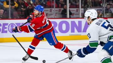 Nov 12, 2023; Montreal, Quebec, CAN; Montreal Canadiens defenseman Mike Matheson (8) breaks his stick as he shoots the puck against the Vancouver Canucks during the second period at Bell Centre. Mandatory Credit: David Kirouac-USA TODAY Sports