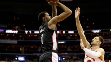 WASHINGTON, DC - DECEMBER 28: Trevor Ariza #1 of the Washington Wizards shoots over the Zach LaVine #8 of the Chicago Bulls in the first half at Capital One Arena on December 28, 2018 in Washington, DC. NOTE TO USER: User expressly acknowledges and agrees that, by downloading and or using this photograph, User is consenting to the terms and conditions of the Getty Images License Agreement. (Photo by Rob Carr/Getty Images)