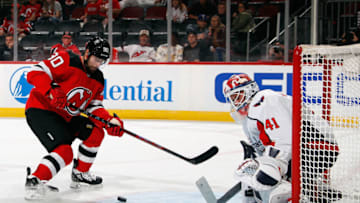 NEWARK, NEW JERSEY - OCTOBER 04: Tomas Tatar #90 of the New Jersey Devils is stopped by Vitek Vanecek #41 of the Washington Capitals during the second period in a preseason game at the Prudential Center on October 04, 2021 in Newark, New Jersey. (Photo by Bruce Bennett/Getty Images)