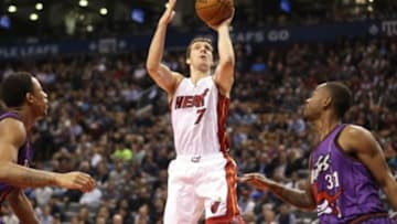 Mar 13, 2015; Toronto, Ontario, CAN; Miami Heat point guard Goran Dragic (7) shoots the ball against the Toronto Raptors at Air Canada Centre. The Raptors beat the Heat 102-92. Mandatory Credit: Tom Szczerbowski-USA TODAY Sports