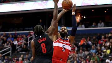 WASHINGTON, DC - NOVEMBER 18: Markieff Morris #5 of the Washington Wizards shoots over Al-Farouq Aminu #8 of the Portland Trail Blazers during the first half at Capital One Arena on November 18, 2018 in Washington, DC. NOTE TO USER: User expressly acknowledges and agrees that, by downloading and or using this photograph, User is consenting to the terms and conditions of the Getty Images License Agreement. (Photo by Will Newton/Getty Images)