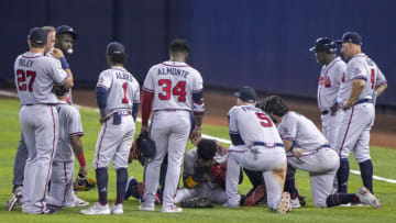 MIAMI, FL - JULY 10: Ronald Acuna Jr. #13 of the Atlanta Braves sits with his head in this hands after an injury during the fifth inning against the Miami Marlins during the fifth inning against the Miami Marlins at loanDepot park on July 10, 2021 in Miami, Florida. (Photo by Eric Espada/Getty Images)