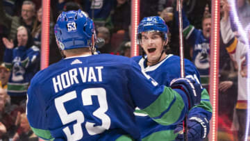 VANCOUVER, BC - FEBRUARY 22: Loui Eriksson #21 of the Vancouver Canucks celebrates with teammate Bo Horvat #53 after scoring a goal against the Boston Bruins during NHL action at Rogers Arena on February 22, 2020 in Vancouver, Canada. (Photo by Rich Lam/Getty Images)