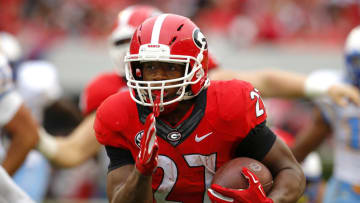 ATHENS, GA - SEPTEMBER 26: Georgia football running back Nick Chubb (#27) rushes in for a touchdown in the third quarter of the game against the Southern University Jaguars on September 26, 2015 at Sanford Stadium in Athens, Georgia. The Georgia Bulldogs won 48-6. (Photo by Todd Kirkland/Getty Images)