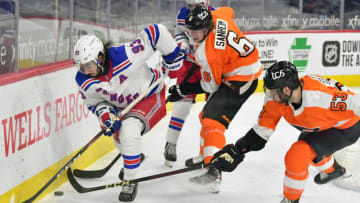 Feb 18, 2021; Philadelphia, Pennsylvania, USA; New York Rangers center Mika Zibanejad (93) and Philadelphia Flyers defenseman Shayne Gostisbehere (53) battle for the puck during the second period at Wells Fargo Center. Mandatory Credit: Eric Hartline-USA TODAY Sports