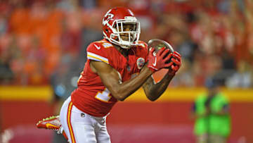KANSAS CITY, MO - AUGUST 31: Wide receiver Demarcus Robinson #14 of the Kansas City Chiefs catches a touchdown pass against the Tennessee Titans during the first half of a preseason game on August 31, 2017 at Arrowhead Stadium in Kansas City, Missouri. (Photo by Peter G. Aiken/Getty Images)