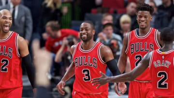 Nov 15, 2016; Portland, OR, USA; Chicago Bulls forward Taj Gibson (22) and guard Dwyane Wade (3) and forward Jimmy Butler (21) and guard Jerian Grant (2) react after a dunk by Wade against the Portland Trail Blazers during the third quarter at the Moda Center. Mandatory Credit: Craig Mitchelldyer-USA TODAY Sports
