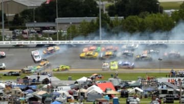 Jul 6, 2014; Daytona Beach, FL, USA; NASCAR Sprint Cup Series drivers wreck going into turn three on lap 97 during the Coke Zero 400 at Daytona International Speedway. Mandatory Credit: John David Mercer-USA TODAY Sports