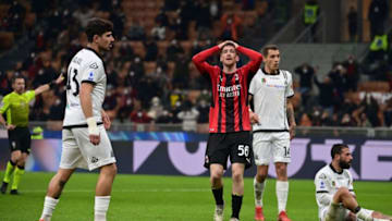 AC Milan's Belgian midfielder Alexis Saelemaekers (C) reacts after missing a goal opportunity during the Italian Serie A football match between AC Milan and Spezia on January 17, 2022 at the San Siro stadium in Milan. (Photo by MIGUEL MEDINA / AFP) (Photo by MIGUEL MEDINA/AFP via Getty Images)