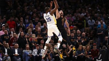 CLEVELAND, OH - JUNE 06: Kevin Durant #35 of the Golden State Warriors attempts a jumper over Kevin Love #0 of the Cleveland Cavaliers in the second half during Game Three of the 2018 NBA Finals at Quicken Loans Arena on June 6, 2018 in Cleveland, Ohio. NOTE TO USER: User expressly acknowledges and agrees that, by downloading and or using this photograph, User is consenting to the terms and conditions of the Getty Images License Agreement. (Photo by Gregory Shamus/Getty Images)