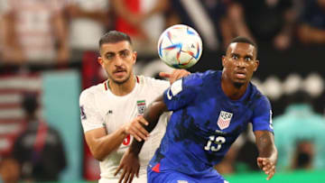 DOHA, QATAR - NOVEMBER 29: Haji Wright (19) of USA in action against Saeid Ezatolahi (6) of Iran during the FIFA World Cup Qatar 2022 Group B match between Iran and USA at Al Thumama Stadium in Doha, Qatar on November 29, 2022. (Photo by Evrim Aydin/Anadolu Agency via Getty Images)