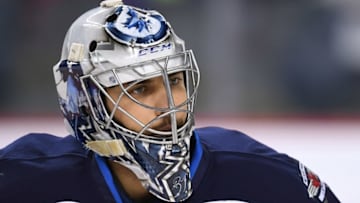 Oct 2, 2016; Calgary, Alberta, CAN; Winnipeg Jets goalie Ondrej Pavelec (31) warms up prior to game against the Calgary Flames at Scotiabank Saddledome. Mandatory Credit: Candice Ward-USA TODAY Sports