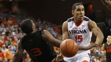 Jan 12, 2016; Charlottesville, VA, USA; Miami Hurricanes forward Anthony Lawrence Jr. (3) draws a charge on Virginia Cavaliers guard Malcolm Brogdon (15) in the second half at John Paul Jones Arena. The Cavaliers won 66-58. Mandatory Credit: Geoff Burke-USA TODAY Sports