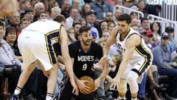 Apr 1, 2016; Salt Lake City, UT, USA; Minnesota Timberwolves guard Ricky Rubio (9) battles for the ball with Utah Jazz forward Joe Ingles (2) and guard Raul Neto (25) in the fourth quarter at Vivint Smart Home Arena. The Utah Jazz defeated the Minnesota Timberwolves 98-85. Mandatory Credit: Jeff Swinger-USA TODAY Sports