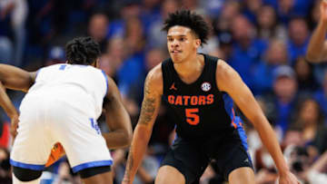 Feb 4, 2023; Lexington, Kentucky, USA; Florida Gators guard Will Richard (5) defends against Kentucky Wildcats guard Antonio Reeves (12) during the first half at Rupp Arena at Central Bank Center. Mandatory Credit: Jordan Prather-USA TODAY Sports
