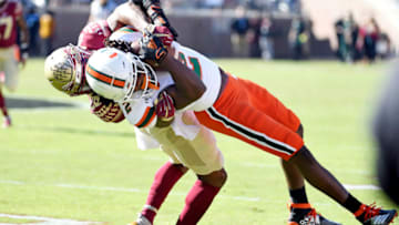 Nov 2, 2019; Tallahassee, FL, USA; Miami Hurricanes wide receiver KJ Osborn (2) is tackled by Florida State Seminoles defensive back Asante Samuels Jr (26) during the first quarter at Doak Campbell Stadium. Mandatory Credit: Melina Myers-USA TODAY Sports
