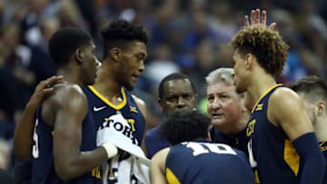 KANSAS CITY, MISSOURI - MARCH 14: Head coach Bob Huggins of the West Virginia Mountaineers talks with players during a timeout in the quarterfinal game of the Big 12 Basketball Tournament against the Texas Tech Red Raiders at Sprint Center on March 14, 2019 in Kansas City, Missouri. (Photo by Jamie Squire/Getty Images)