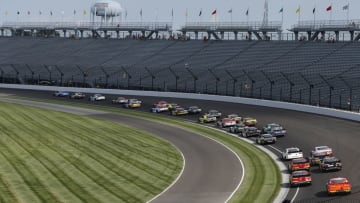 Jul 23, 2016; Indianapolis, IN, USA; NASCAR Xfinity drivers Kyle Busch (18) leads the field for the start of the Lilly Diabetes 250 at Indianapolis Motor Speedway. Mandatory Credit: Brian Spurlock-USA TODAY Sports
