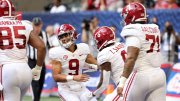 Sep 4, 2021; Atlanta, Georgia, USA; Alabama Crimson Tide quarterback Bryce Young (9) reacts after running back Trey Sanders (6) scored a touchdown during the third quarter of their game against the Miami Hurricanes at Mercedes-Benz Stadium. Mandatory Credit: Jason Getz-USA TODAY Sports